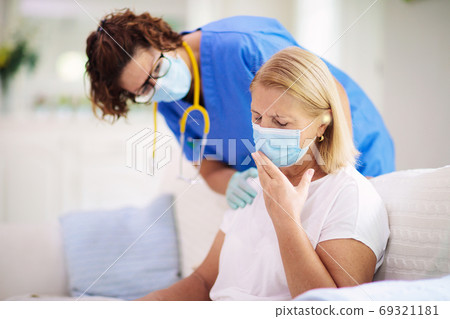 Doctor examining sick patient. Ill woman in clinic Doctor examining sick patient. Ill woman in clinic 69321181