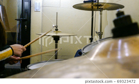 Playing drums on drum kit Playing drums on drum kit 69323472