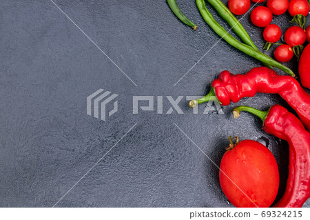 red vegetables on a black table, mockup, copy space one red vegetables on a black table, mockup, copy space one 69324215