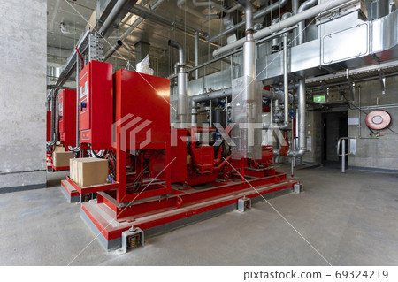 Fire pumps inside a modern building Fire pumps inside a modern building 69324219