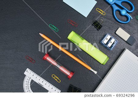 back to school, school supplies lying parallel on black chalkboard, copy space, top view, close up back to school, school supplies lying parallel on black chalkboard, copy space, top view, close up 69324296
