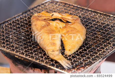Dried tilefish (Amadai), charcoal-grilled on a shichirin 69324499