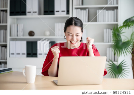Excited female feeling euphoric celebrating online win success achievement result Excited female feeling euphoric celebrating online win success achievement result 69324551