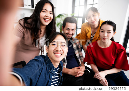 Selfie of group young man and woman team smiling having fun together 69324553