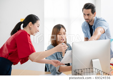 Coworking process, Corporate employees team working brainstorm project with computer desktop Coworking process, Corporate employees team working brainstorm project with computer desktop 69324556