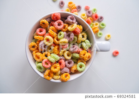 top view of Colored Breakfast Cereal in a white Bowl 69324581