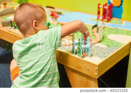 little caucasian boy playing educational games one little caucasian boy playing educational games one 69325105