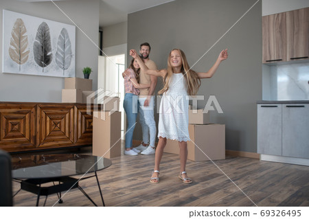 Cute long-haired girl feeling excited and happy Cute long-haired girl feeling excited and happy 69326495