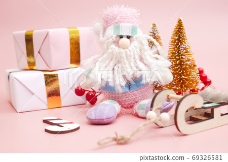 Christmas composition, gifts on pastel pink background, copyspace Christmas composition, gifts on pastel pink background, copyspace 69326581