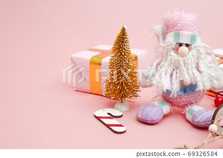 Christmas composition, gifts on pastel pink background, copyspace Christmas composition, gifts on pastel pink background, copyspace 69326584