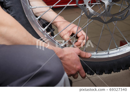 Motorcycle wheel repair after tire leaks or disc damage. Motorcycle wheel repair after tire leaks or disc damage. 69327340