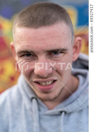 A bully guy in a light sports jacket with a hood A bully guy in a light sports jacket with a hood 69327417