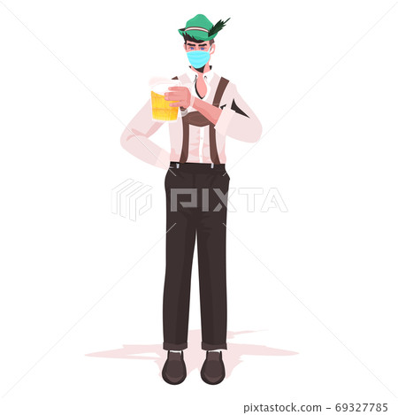man in medical mask holding beer mug Oktoberfest party celebration coronavirus quarantine concept man in medical mask holding beer mug Oktoberfest party celebration coronavirus quarantine concept 69327785