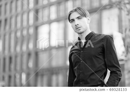 Portrait of a gay man - member of the LGBTQ community. Black and white photo. BW Portrait of a gay man - member of the LGBTQ community. Black and white photo. BW 69328133
