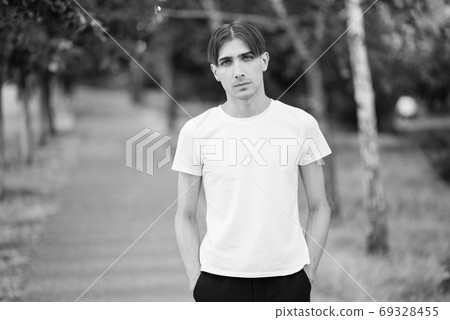 Portrait of a gay man - member of the LGBTQ community. Black and white photo. BW 69328455