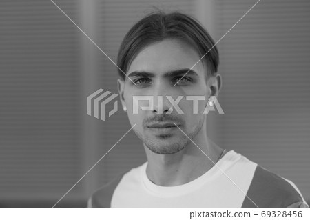 Portrait of a gay man - member of the LGBTQ community. Black and white photo. BW 69328456
