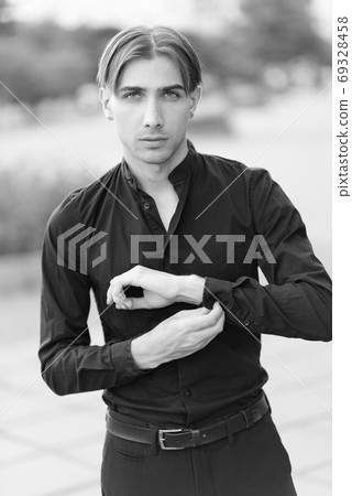 Portrait of a gay man - member of the LGBTQ community. Black and white photo. BW 69328458