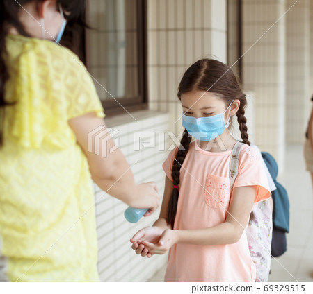 Students washing hand with Alcohol Sanitizer at school Students washing hand with Alcohol Sanitizer at school 69329515