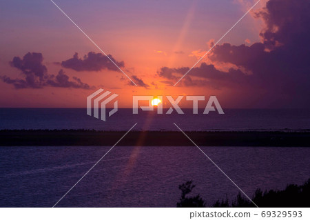 Beach near the airport in Kumejima, Okinawa Prefecture Sunset on Shinrihama beach, orange sunset Twilight landscape photograph 69329593