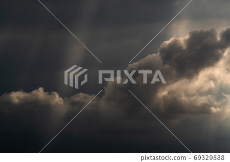 Summer sky Rain clouds and spilling sunlight covering the late summer sky e-2 High contrast Summer sky Rain clouds and spilling sunlight covering the late summer sky e-2 High contrast 69329888