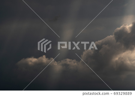 Summer sky Rain clouds and spilling sunlight covering the late summer sky f-1 69329889