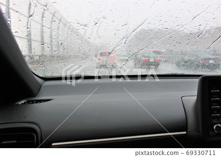 Downpour seen from the window in the car Downpour seen from the window in the car 69330711