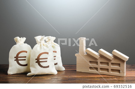 Euro money bags and industrial factory plant. Investment modernization, automation, reduction of the impact on environment. Privatization and purchase of industrial complexes. Supporting economy. 69332516