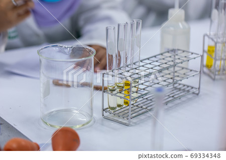 Sample analysis using Spectrophotometer for lab experiments. Sample analysis using Spectrophotometer for lab experiments. 69334348