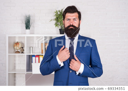 confident businessman in office. great man to follow.  69334351