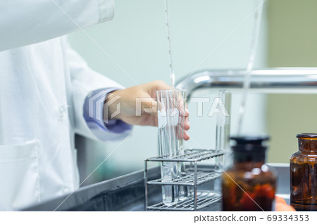 Sample analysis using Spectrophotometer for lab experiments. Sample analysis using Spectrophotometer for lab experiments. 69334353