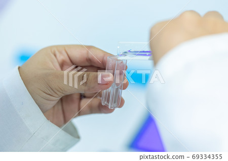 Sample analysis using Spectrophotometer for lab experiments. Sample analysis using Spectrophotometer for lab experiments. 69334355
