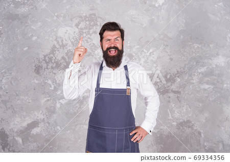 Man denim apron stylish barbershop staff bearded hipster, spread inspiration concept Man denim apron stylish barbershop staff bearded hipster, spread inspiration concept 69334356