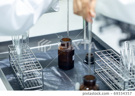 Sample analysis using Spectrophotometer for lab experiments. Sample analysis using Spectrophotometer for lab experiments. 69334357