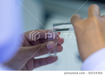 Sample analysis using Spectrophotometer for lab experiments. Sample analysis using Spectrophotometer for lab experiments. 69334368