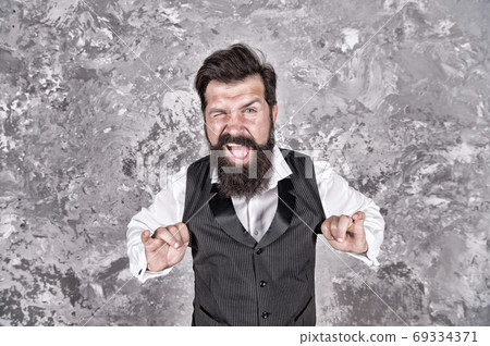 Friendly wink. Caucasian man wink eye on abstract wall. 69334371