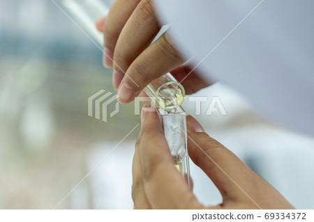 Sample analysis using Spectrophotometer for lab experiments. Sample analysis using Spectrophotometer for lab experiments. 69334372