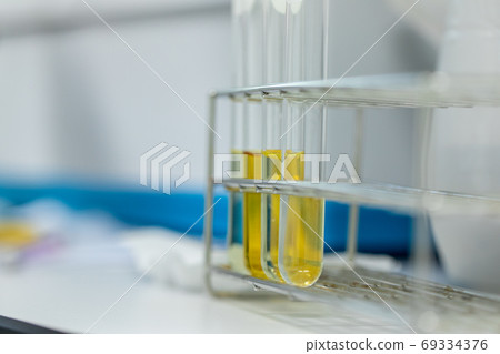 Sample analysis using Spectrophotometer for lab experiments. Sample analysis using Spectrophotometer for lab experiments. 69334376