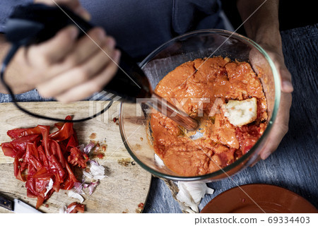preparing porra antequerana, a cold tomato soup 69334403