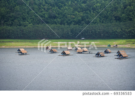 Landscape of river mountain and bamboo houseboat raft floating o 69336583
