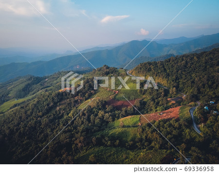 Mountains and green trees during the day 69336958