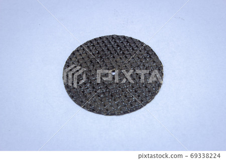 Small emery disk used for cutting and working with metals Small emery disk used for cutting and working with metals 69338224