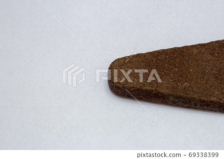Very old whetstone use for sharpen knives and other cutting tools Very old whetstone use for sharpen knives and other cutting tools 69338399