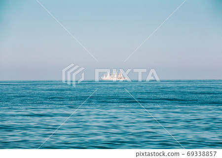 Modern Sail Ship at Sea Ocean On Horizon 69338857