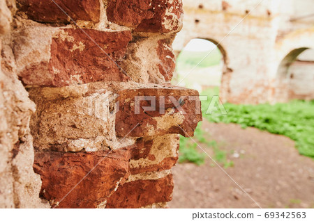 Landscape of ruined buildings at sunset, image of decrepitude or natural disaster. 69342563
