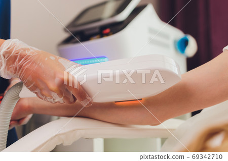 Laser hair removal on ladies legs. Intentional shallow depth of field. Laser hair removal on ladies legs. Intentional shallow depth of field. 69342710