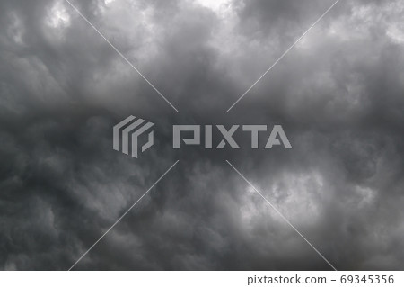 Dark dramatic cloudy overcast sky with thunderstorm clouds 69345356