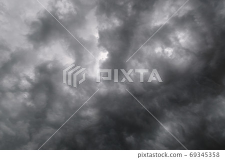 Dark dramatic cloudy overcast sky with thunderstorm clouds 69345358