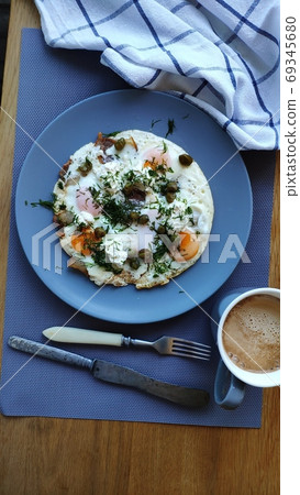 Fried eggs with capers and herbs and coffee, ketogenic breakfast concept, selective focus 69345680