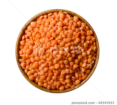 Bowl of red split lentil isolated on white background 69345933