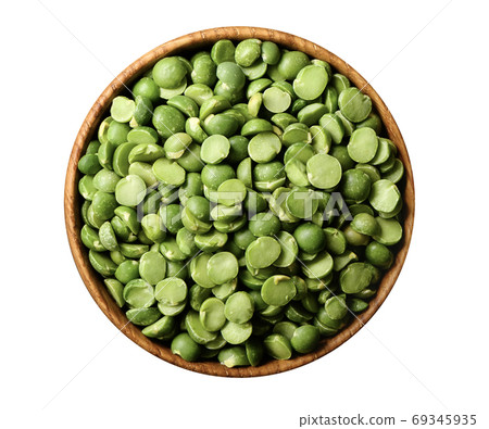 Dried green splin peas in wooden bowl isolated on white Dried green splin peas in wooden bowl isolated on white 69345935